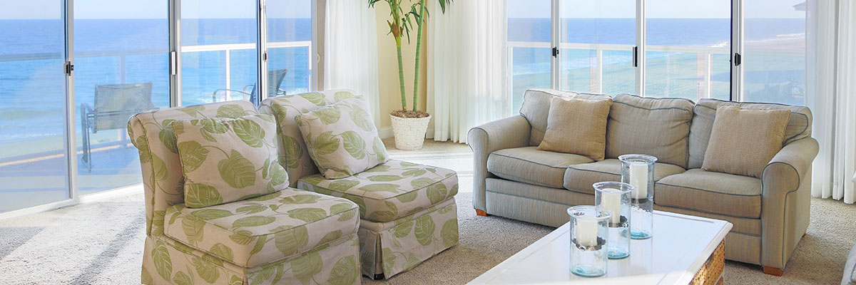 hotel room with couches and windows