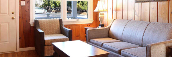 hotel room with couches and windows